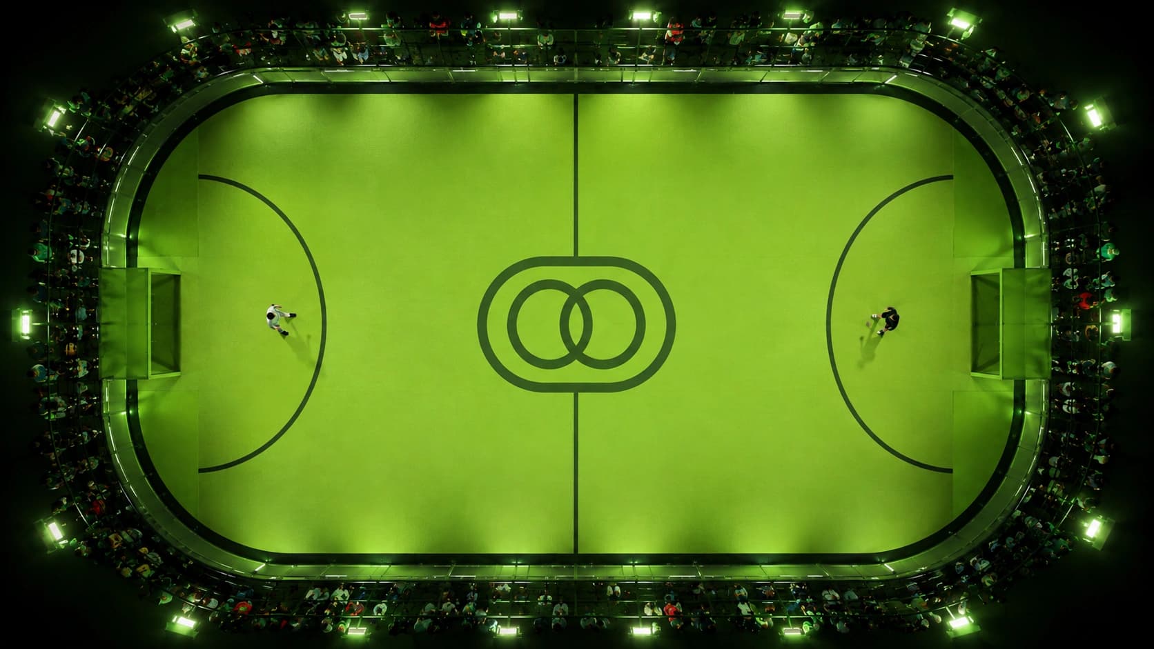 Player striking the ball in mid-air against a green light backdrop