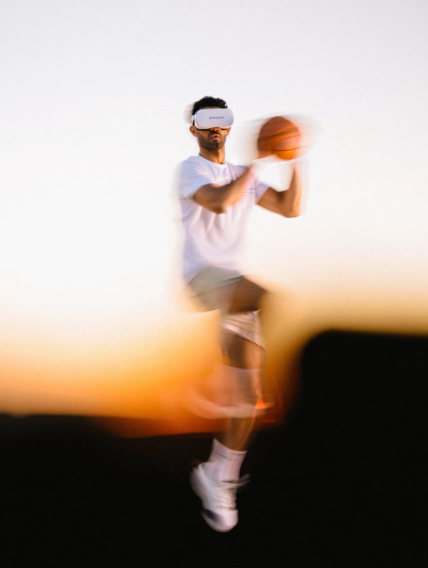 A VSBasket player in VR gear dribbling with motion blur against a bright background