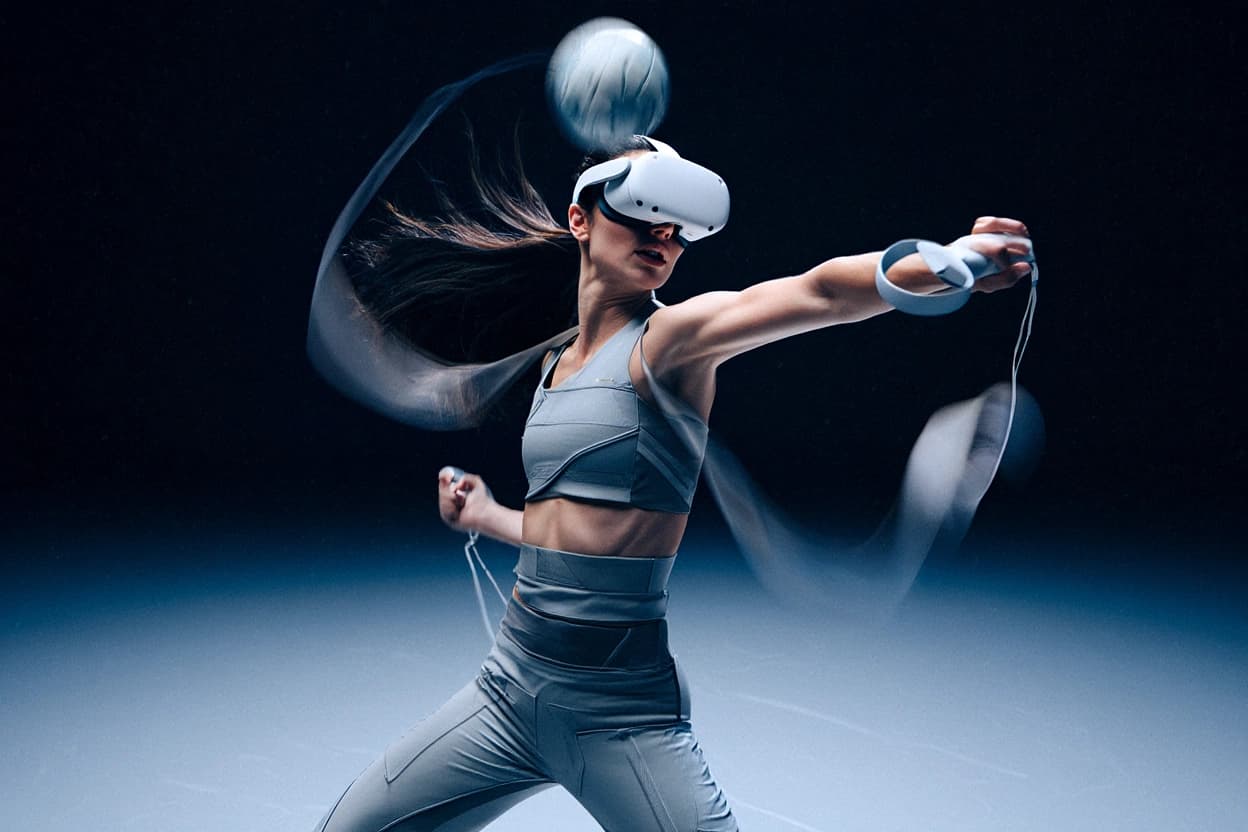 A VSHandball player in a VR headset winding up a throw, hair and ball trailing in motion blur
